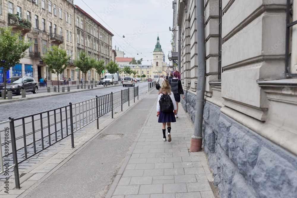 Europe, Lviv, people schoolchildren with backpacks going to school