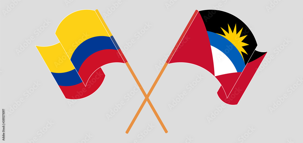 Crossed and waving flags of Antigua and Barbuda and Colombia