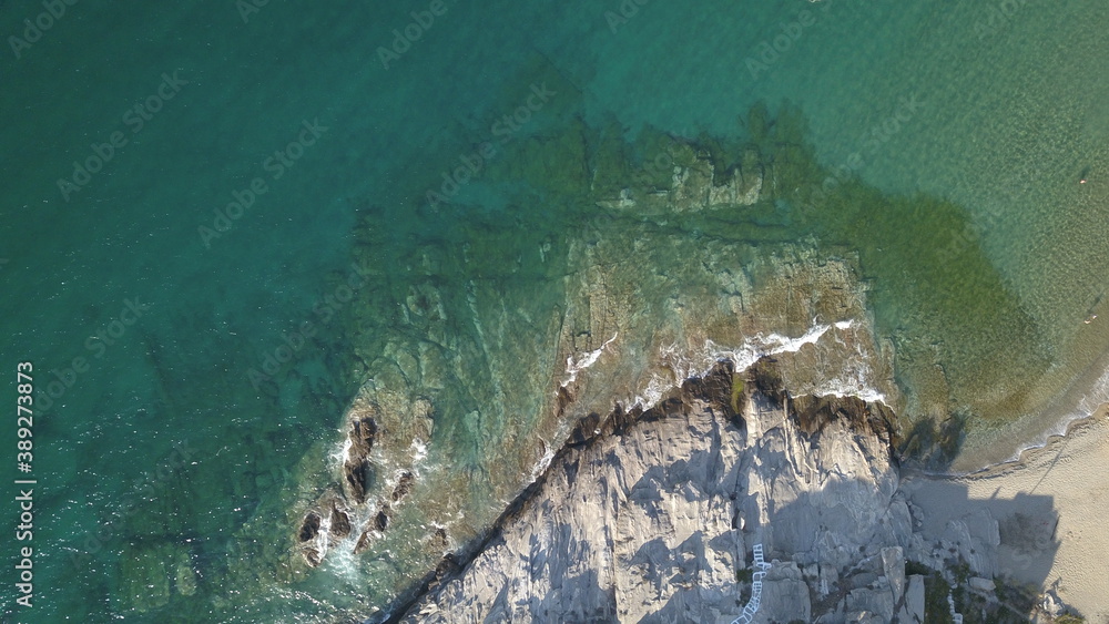 Aerial top view of sea waves break on a beach. drone shot Greece Aerial top view of sea waves break on a beach. drone shot Greece