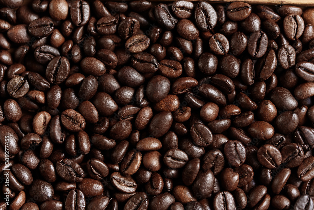 closeup of perfect Roasted coffee beans background. Food ingredients, top view, space for text. Soft selective focus. closeup of perfect Roasted coffee beans background. Food ingredients, top view, space for text. Soft selective focus.