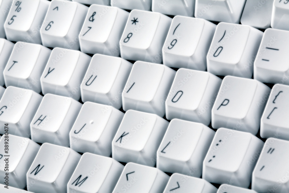 White computer keyboard. Black letters on white buttons. White computer keyboard. Black letters on white buttons.