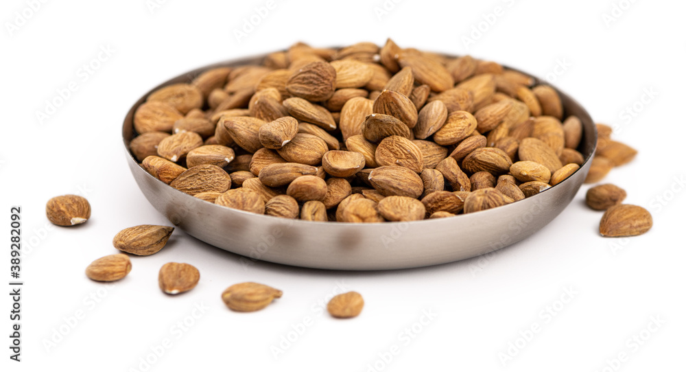 Portion of Apricot Kernels isolated on white (close up shot) Portion of Apricot Kernels isolated on white (close up shot)