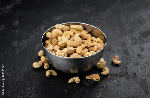 Some roasted Cashew Nuts (close up; selective focus)