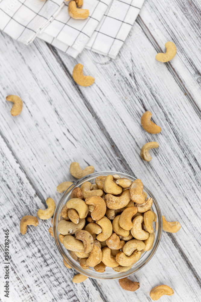 Some roasted Cashew Nuts (close up; selective focus) Some roasted Cashew Nuts (close up; selective focus)