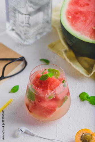 Fresh watermelon, gin cocktail with soda and garnished with mint leaves