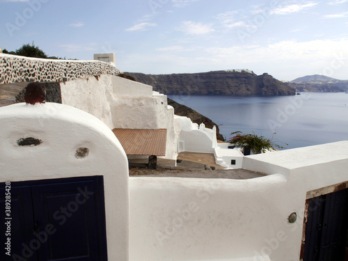 Magic Oia, Sanorini island Greece. Views of the historical part of the city of Oia. Streets and houses of the old city. photo