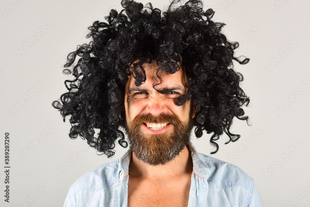 Man in wig. Smiling man in curly wig. Smile. Close up portrait of smiling bearded man. Isolated. Bearded man. Man in wig. Smiling man in curly wig. Smile. Close up portrait of smiling bearded man. Isolated. Bearded man.