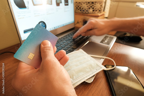  Man using visa credit card for web payment on laptop,tech e-commerce business photo