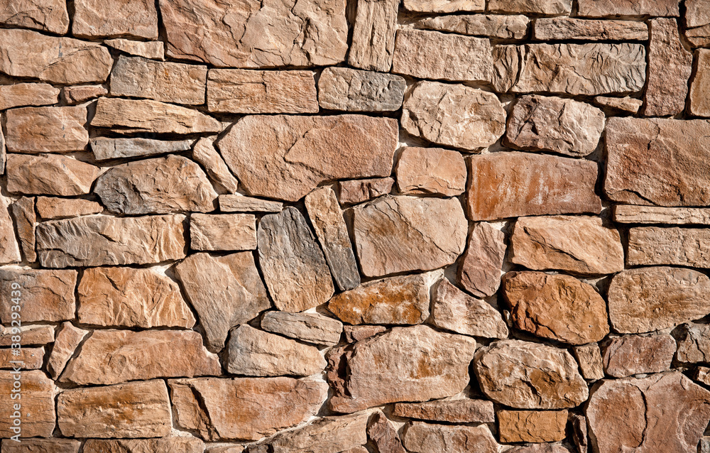 Fototapeta premium The wall is lined with large brown stones