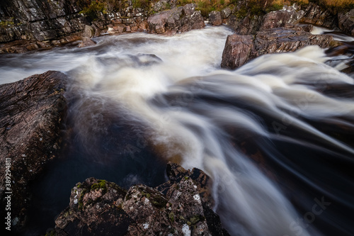 shot of the waterfalls in glen etive near loch etive and the entrance to glencoe and rannoch moor in the argyll region of the highlands of scotland during autumn photo