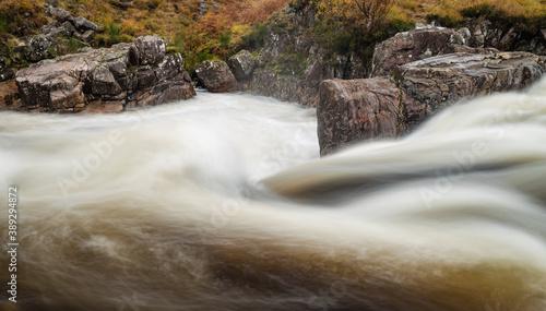 shot of the waterfalls in glen etive near loch etive and the entrance to glencoe and rannoch moor in the argyll region of the highlands of scotland during autumn photo