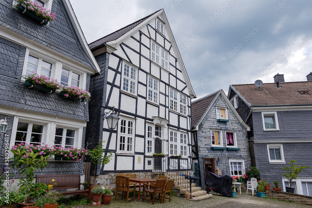 Outdoor street view of small town with traditional German wooden townhouses around Neviges Church in Velbert, Germany. Outdoor street view of small town with traditional German wooden townhouses around Neviges Church in Velbert, Germany.