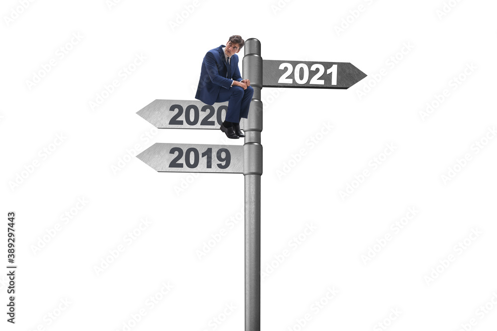 Road sign and businessman with 2020 and 2021 Road sign and businessman with 2020 and 2021