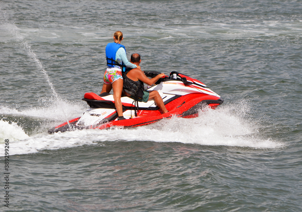 Couple riding on a jetski