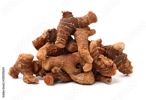 Dried galangal root isolated on white background
