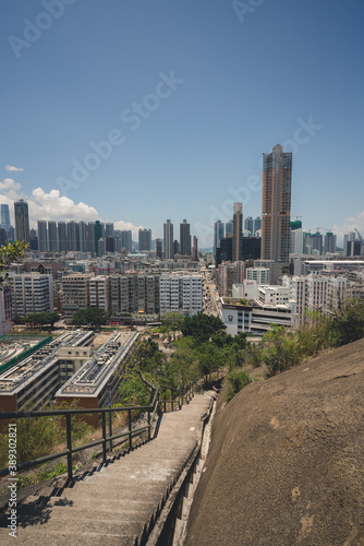 urban city skyline during clear summer day with densely packed buildings in urban setting