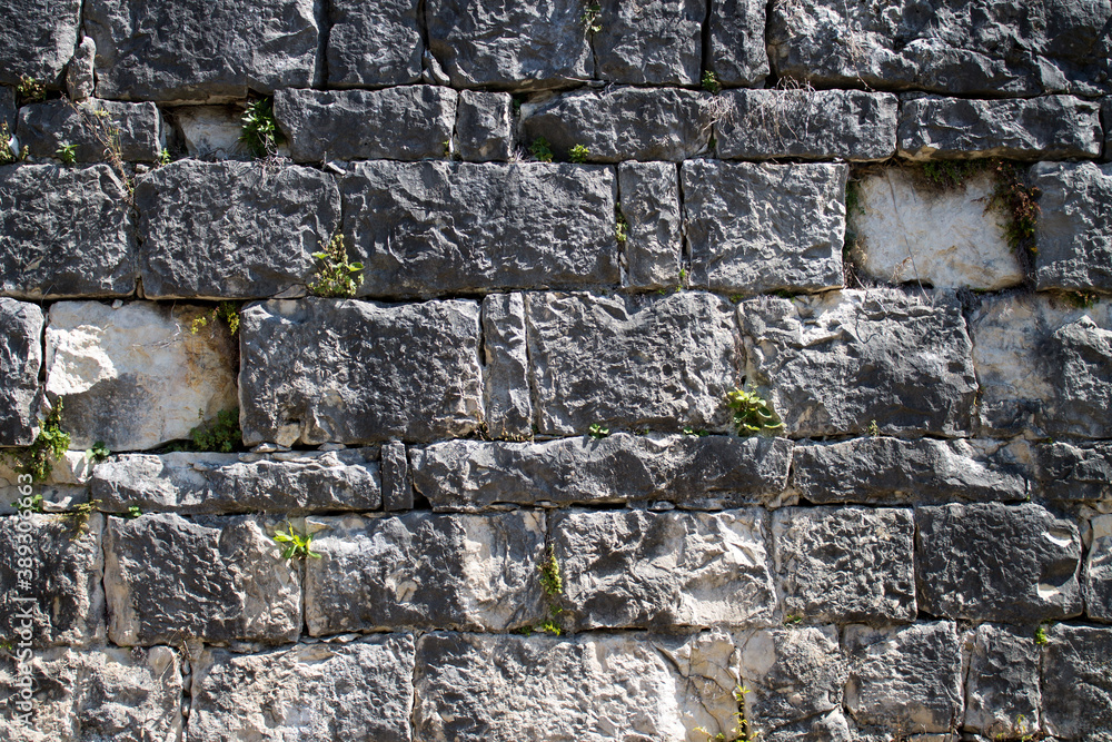 Naklejka premium Stone brick masonry natural stone background for design
