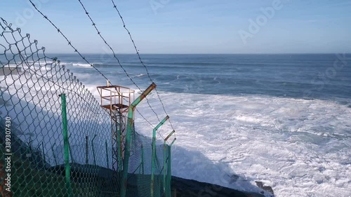 Seascape views from the cliff one day with rough sea and big waves breaking against the rocks