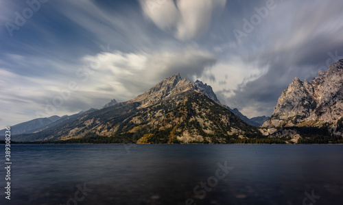 A stunning landscape by the lake shore with huge clouds. 