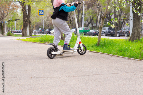 Wallpaper Mural Girl riding a scooter in the city Torontodigital.ca