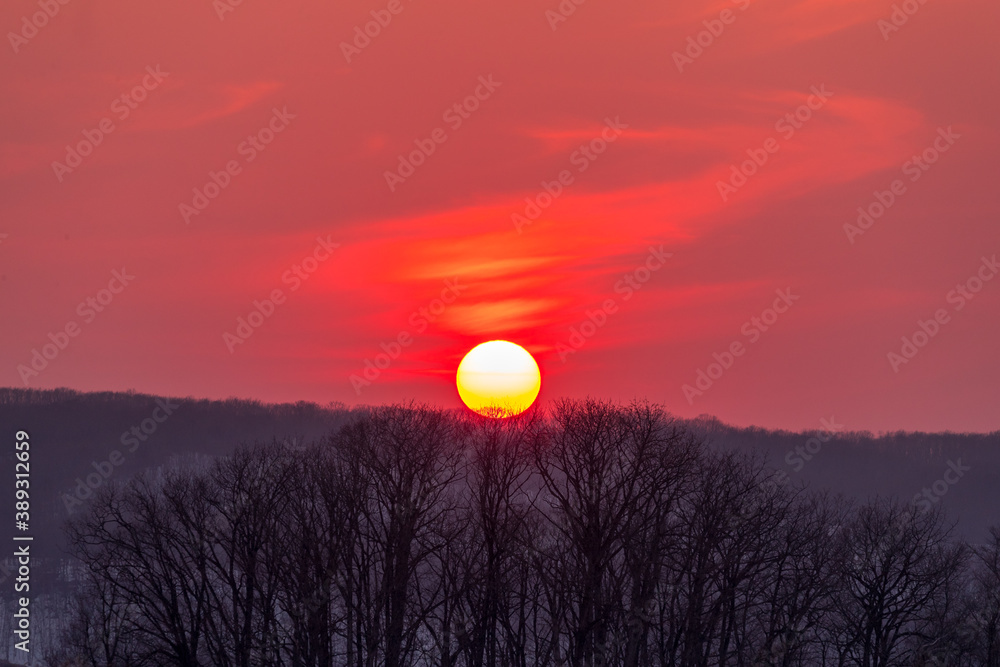 Fototapeta premium red sunset with steam cloud over the mountain in hokkaido japan