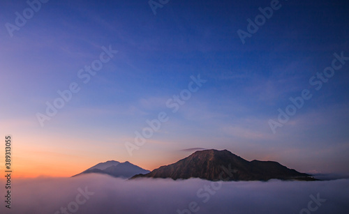 Batur Mountain in Kintamani  Bali Island Indonesia in the morning with blue sky and orange sky 