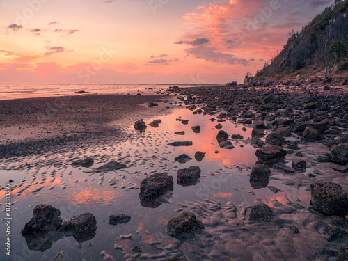 Rocky Beach Sunrise with Hill and Reflections © Kevin