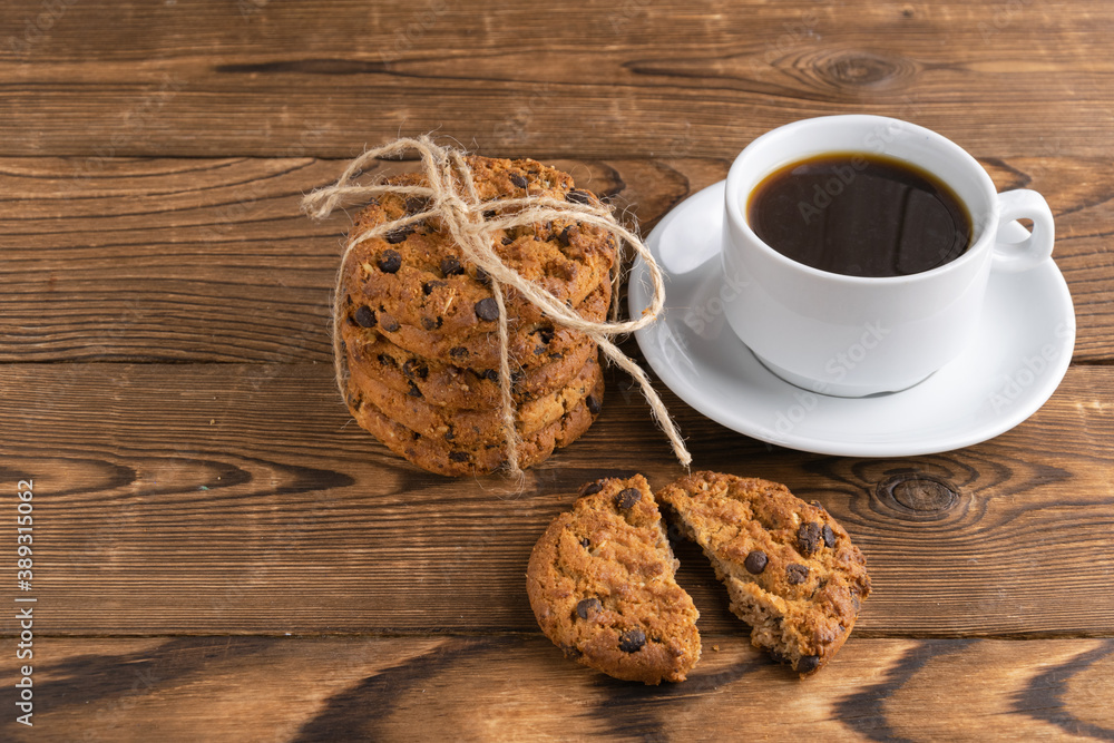 a cup of coffee and homemade cookies with chocolate a cup of coffee and homemade cookies with chocolate