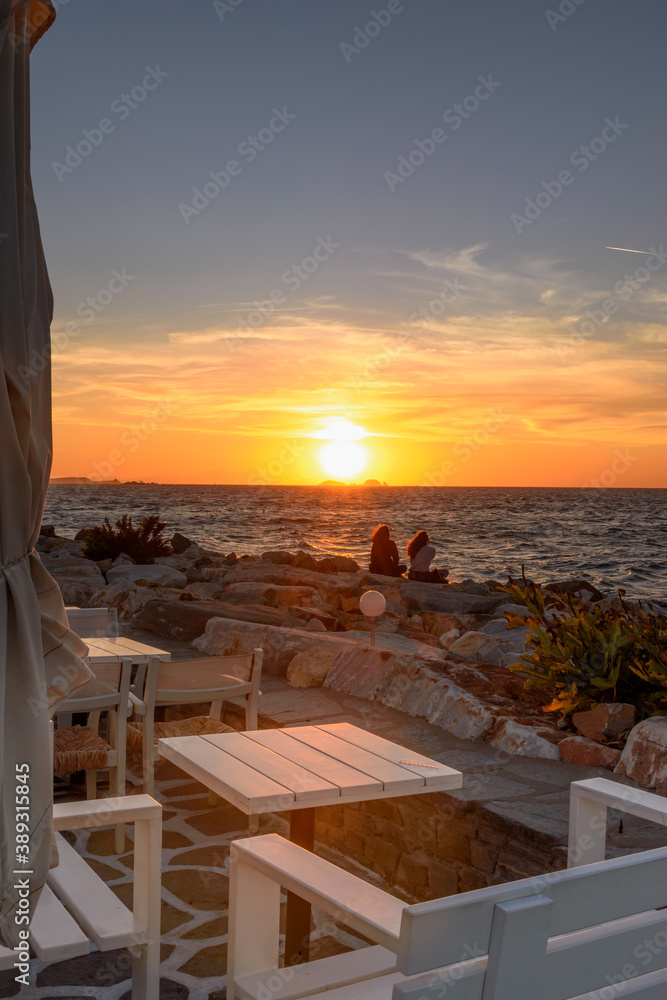 Naklejka premium Watching the sunset from Parikia, Paros island Greece.