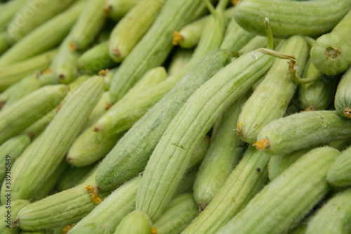 A pile of fresh Armenian cucumber (Cucumis melo var. flexuosus) for sale in the Mahane Yehuda market, Jerusalem, Israel