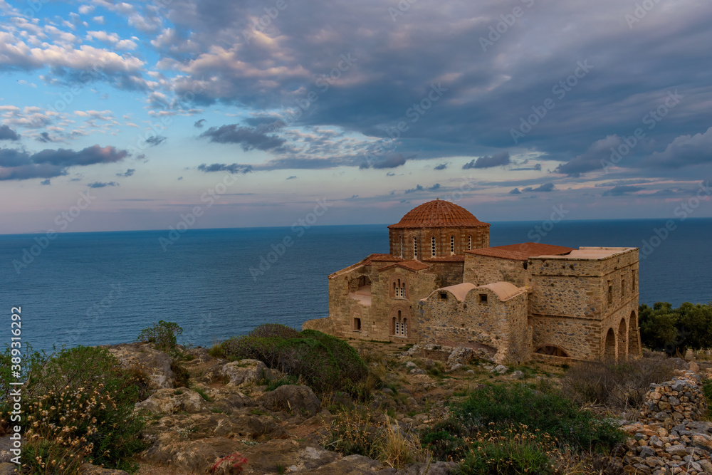 The Byzantine Church of Agia Sofia on the top  of the medieval castle of Monemvasia, with view to the Aegean Sea during an amazing sunset.