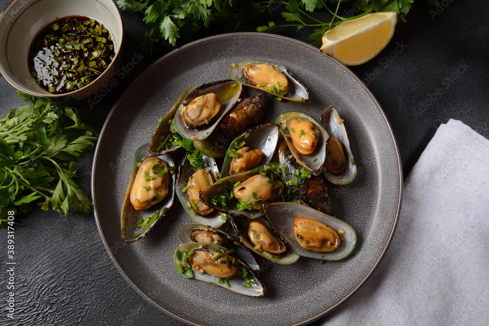 Classic French meal Moules marinière Marinara mussels with garlic, sauce, lemon and parsley. Classic French meal Moules marinière Marinara mussels with garlic, sauce, lemon and parsley.