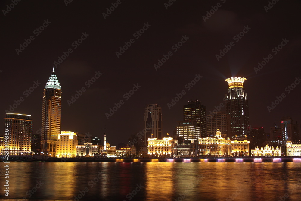 Night view of Shanghai Waitan Skyscrapers with bund center building  and Guangming Finance building along Huangpu river in Shanghai, China.