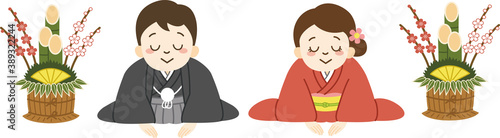 お辞儀をする着物姿の夫婦（門松）