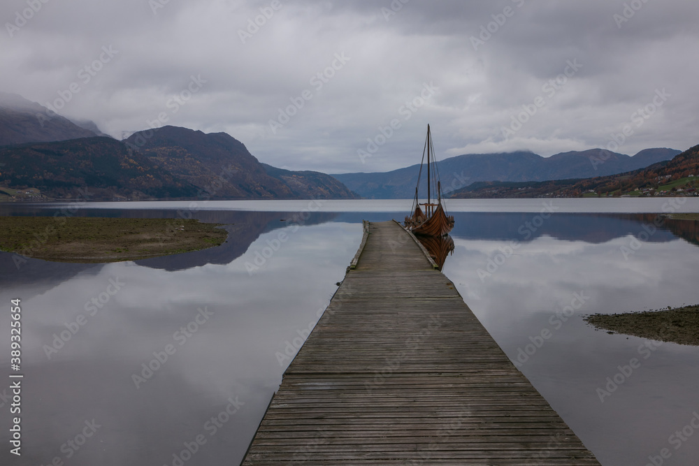 Fototapeta premium viking ship in gorgeous fjord landscape in Norway