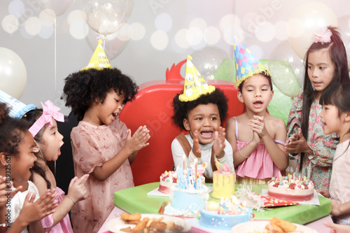 Happy birthday party event  group of adorable kids celebrate birthday party together  happy children have fun together