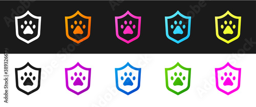 Set Animal health insurance icon isolated on black and white background. Pet protection concept. Dog or cat paw print. Vector.
