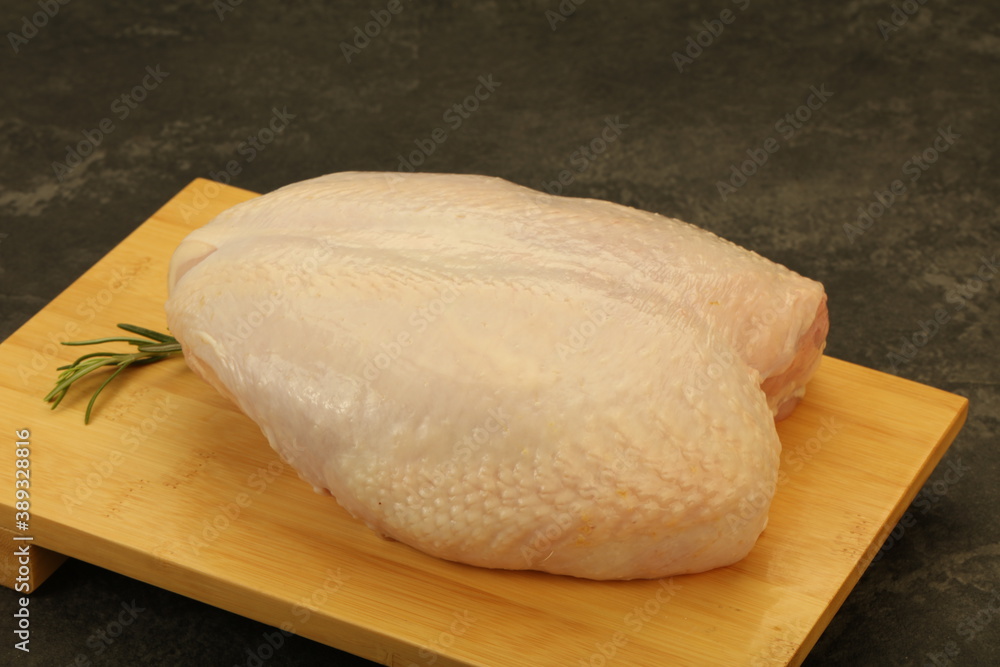 Raw whole chicken breast with skin Raw whole chicken breast with skin