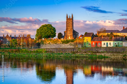 Amazing landscape with a church by the Shannon river in Limerick, Ireland photo