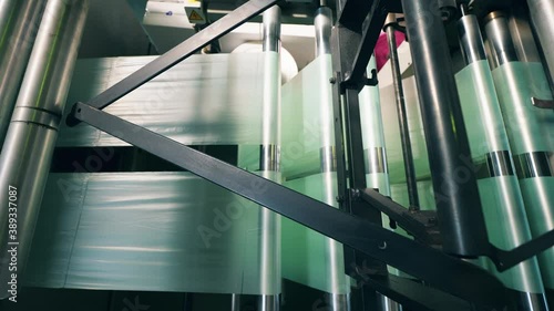 Factory rolling machine with polyethylene going through it