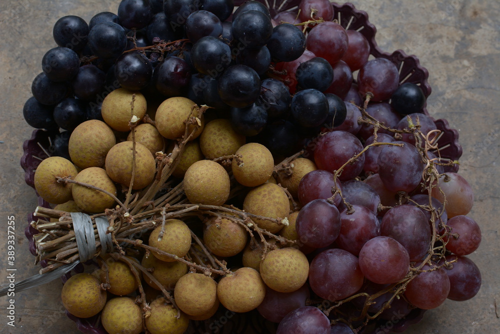 concept photo of fresh fruit, grapes and longan.