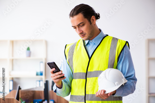 Young male architect working in the office