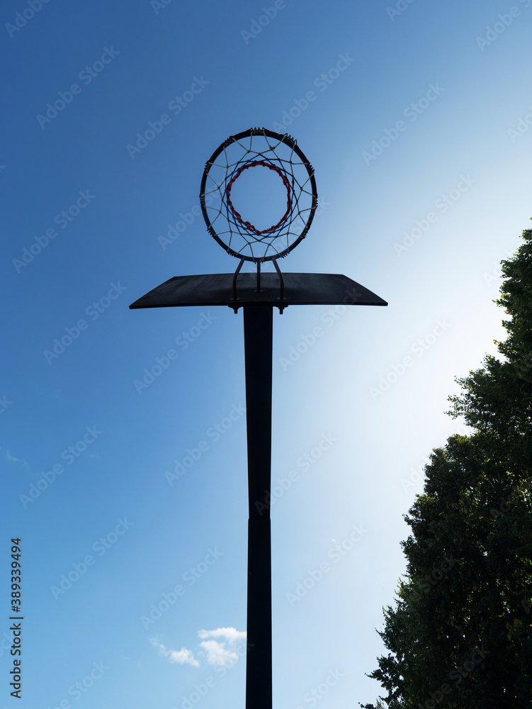Basketball hoop on street playground viewd from bellow. Public Outdoor Basketball court Basketball hoop on street playground viewd from bellow. Public Outdoor Basketball court