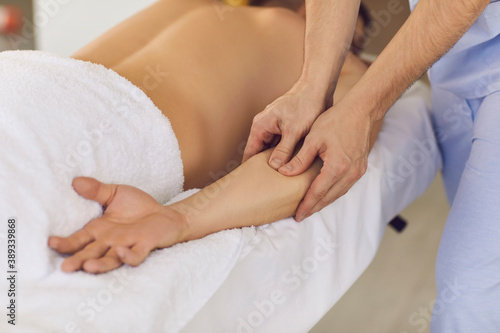 Chiropractor hands doing treatment of acupressure for mans hand