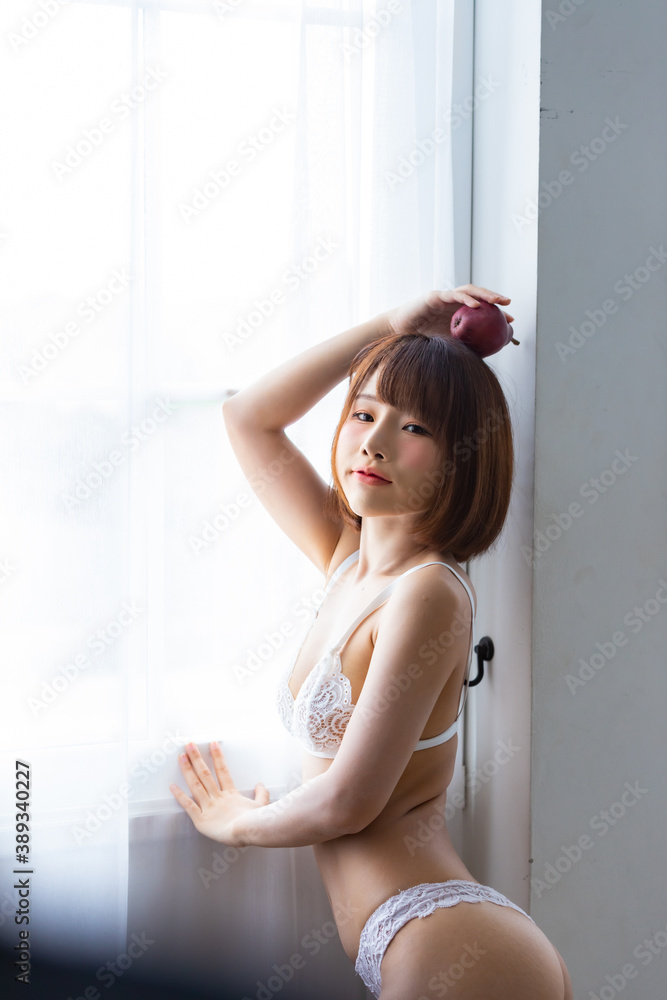 Portrait asian young woman wearing sexy bikini in bedroom Portrait asian young woman wearing sexy bikini in bedroom