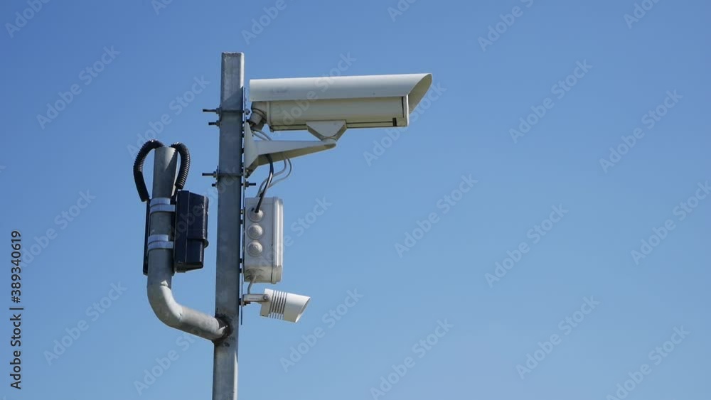 Security camera on a fence with barbed wire. Security systems Restricted area or prison. Restriction of human freedom. Illegal immigration concept. High quality FullHD footage Security camera on a fence with barbed wire. Security systems Restricted area or prison. Restriction of human freedom. Illegal immigration concept. High quality FullHD footage
