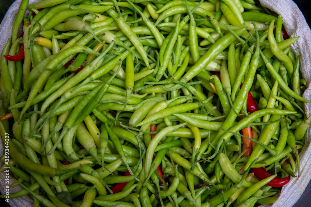top view, fresh vegetables standing in sack at market place. top view, fresh vegetables standing in sack at market place.