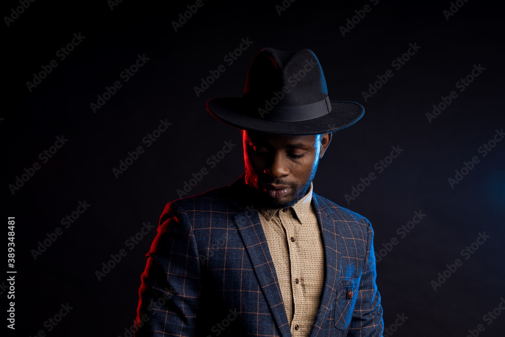 African american business man in black hat in studio
