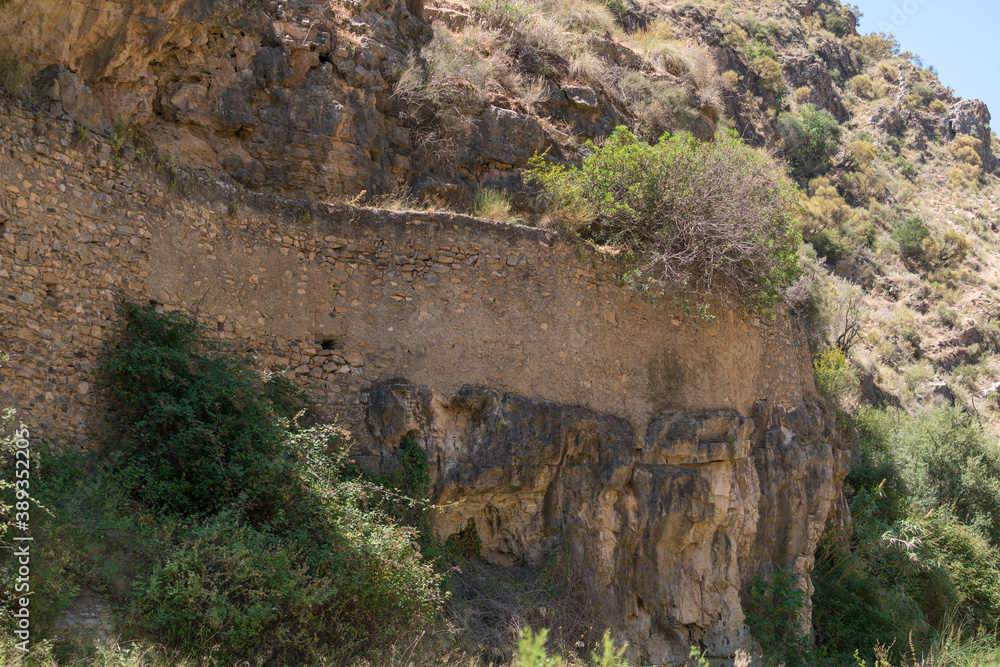 Fototapeta premium stone wall on a mountainside