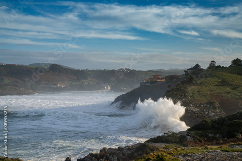 huge waves crashing onto the shores of Cabo de Ajo on the northern Spanish coast
